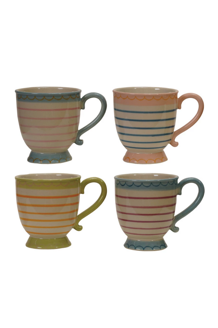 Four ceramic mugs with striped patterns