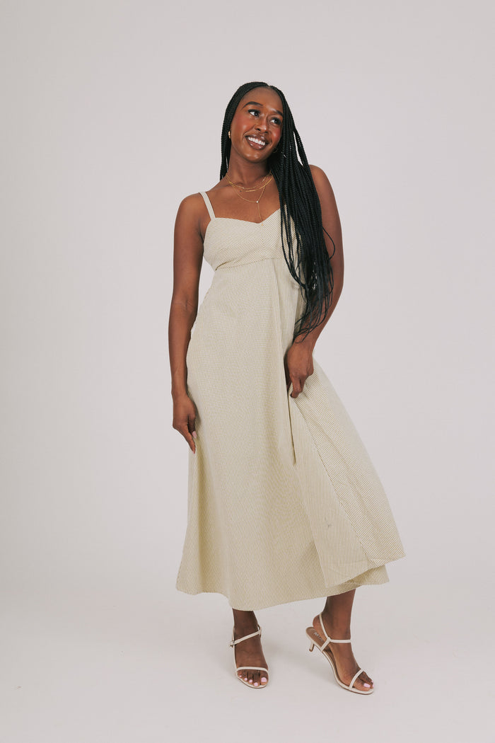 green and white striped midi dress model
