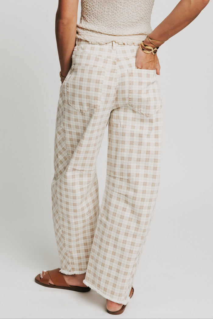 cream plaid barrel jeans with raw hem back