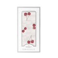 white baby swaddle with cherry pattern by newcastle classics