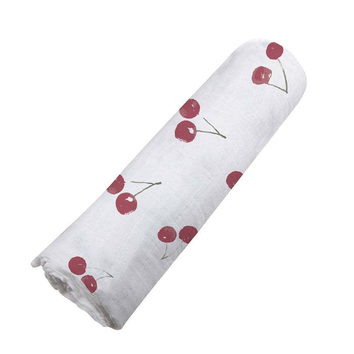 white baby swaddle with cherry pattern by newcastle classics