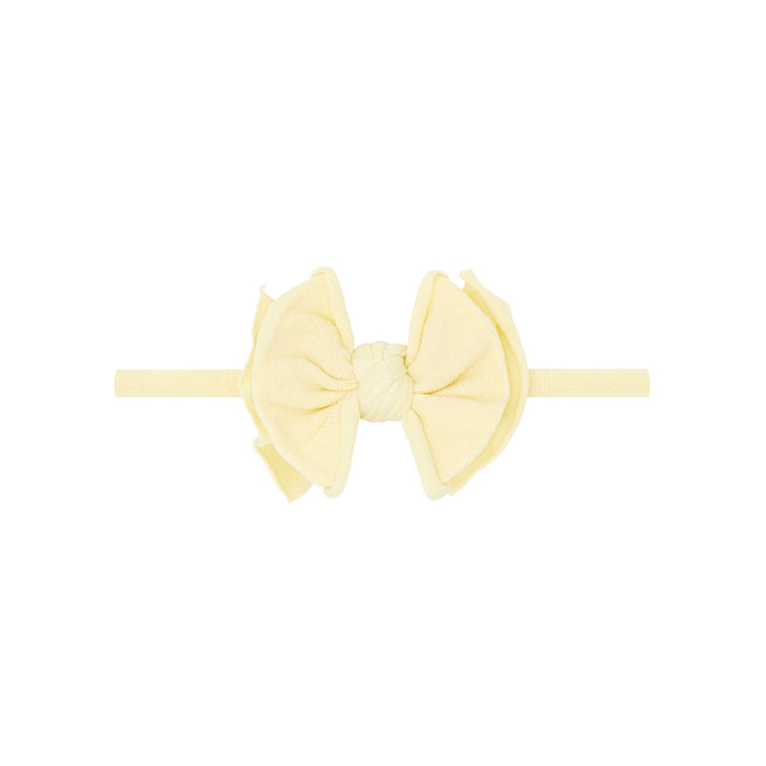 Yellow headband with a large bow on a white background