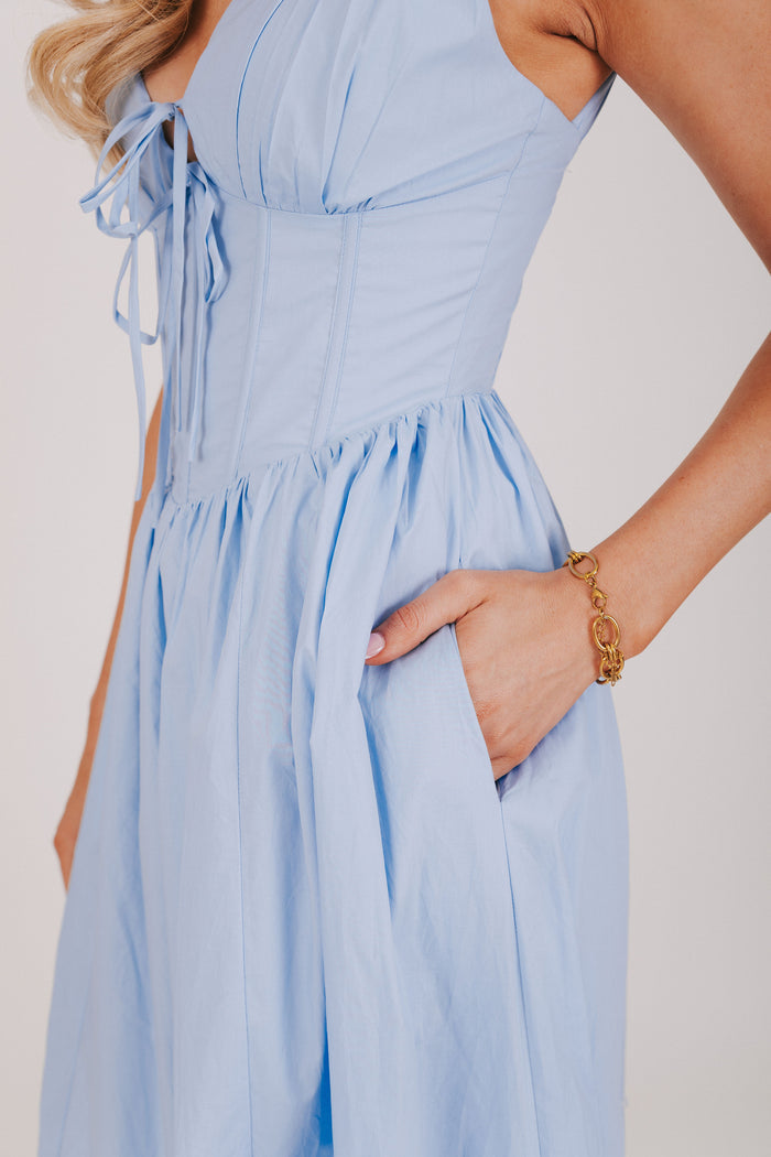blue midi dress with structured bodice close up