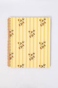 Notebook with floral striped design on a light gray background yellow and strawberry print