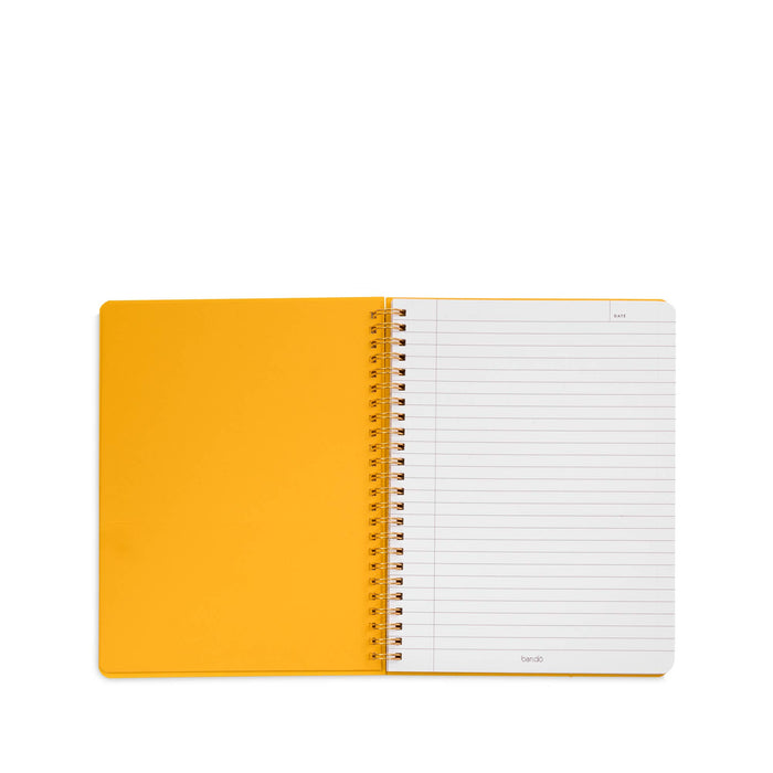 open mini notebook lined paper yellow interior