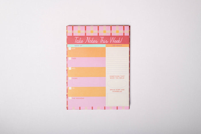Colorful weekly planner pad  on a white background