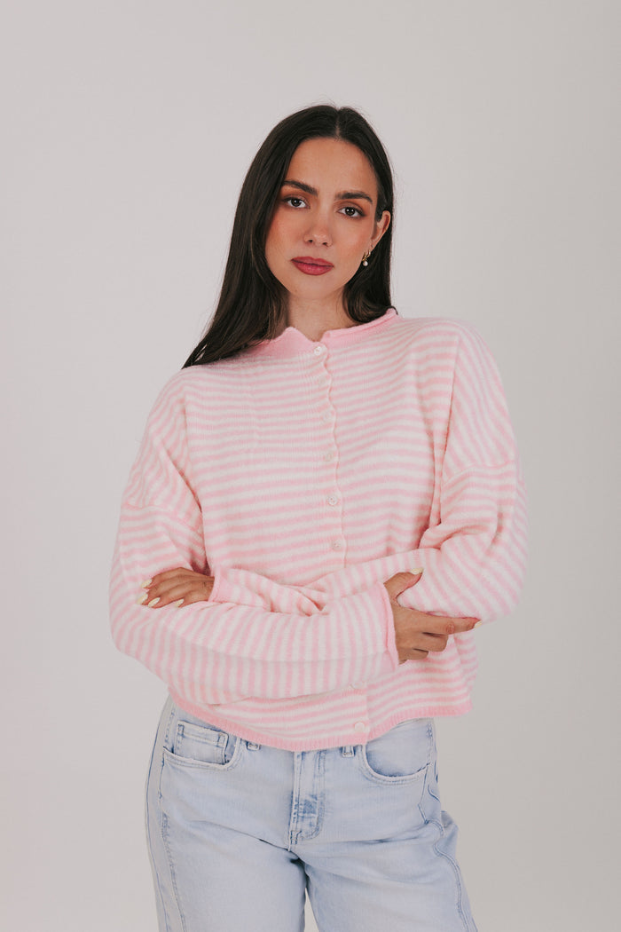 Off white and pink striped sweater with a button down front. Super soft material with rolled edges, long sleeves, and drop shoulders.