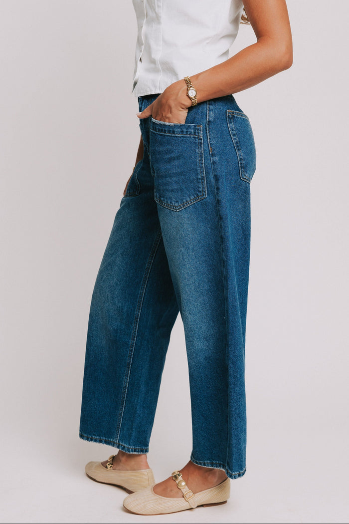 dark wash denim jeans with oversized front pockets side