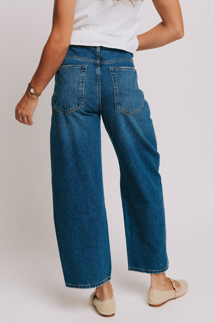 dark wash denim jeans with oversized front pockets back