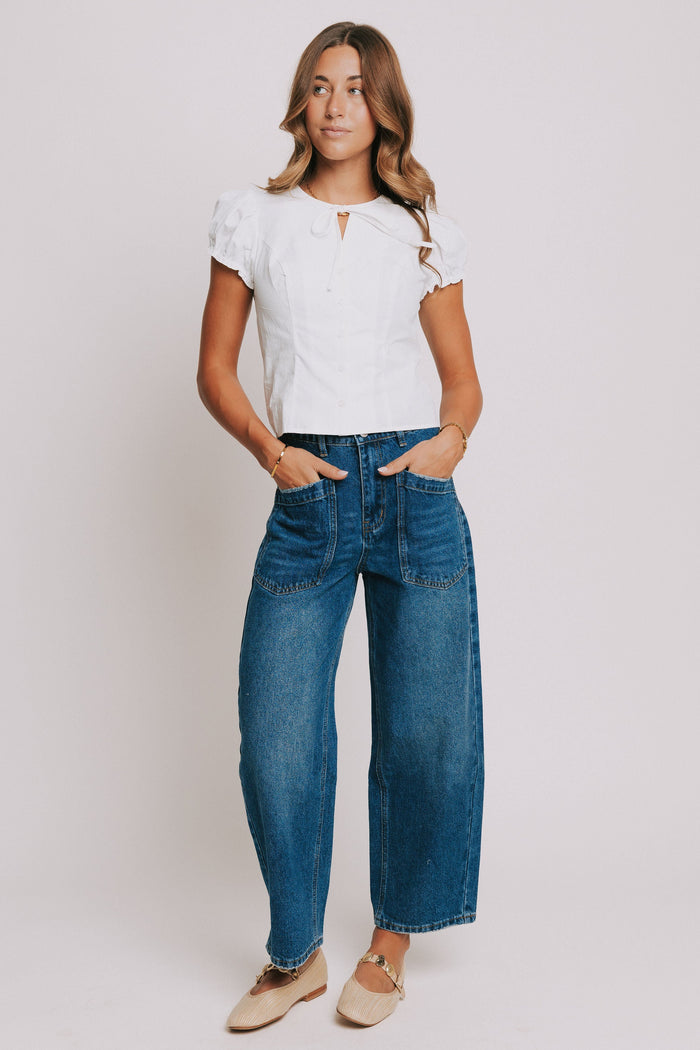 dark wash denim jeans with oversized front pockets full