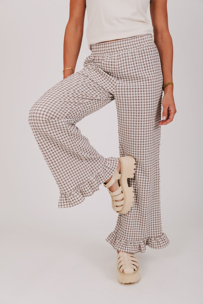 brown and white gingham pants with ruffled cuffs front