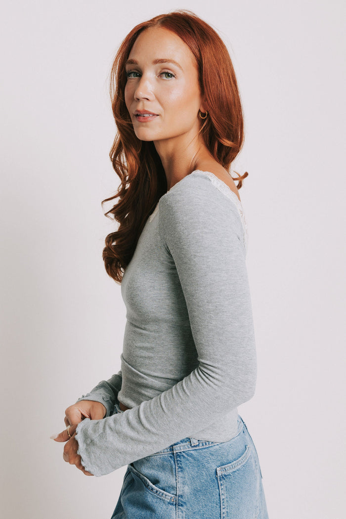 grey long sleeve top with lace trim on the neckline side