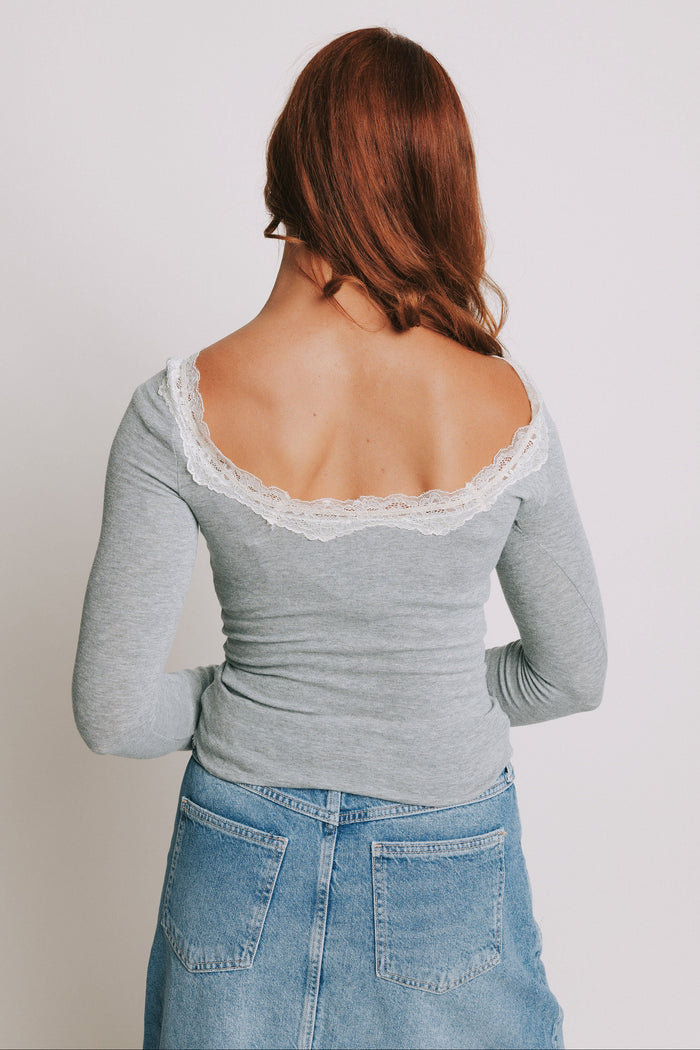 grey long sleeve top with lace trim on neckline back