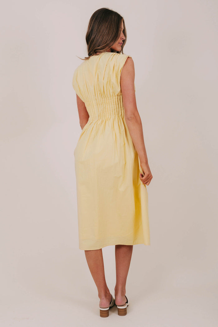 yellow pleated button down midi dress back