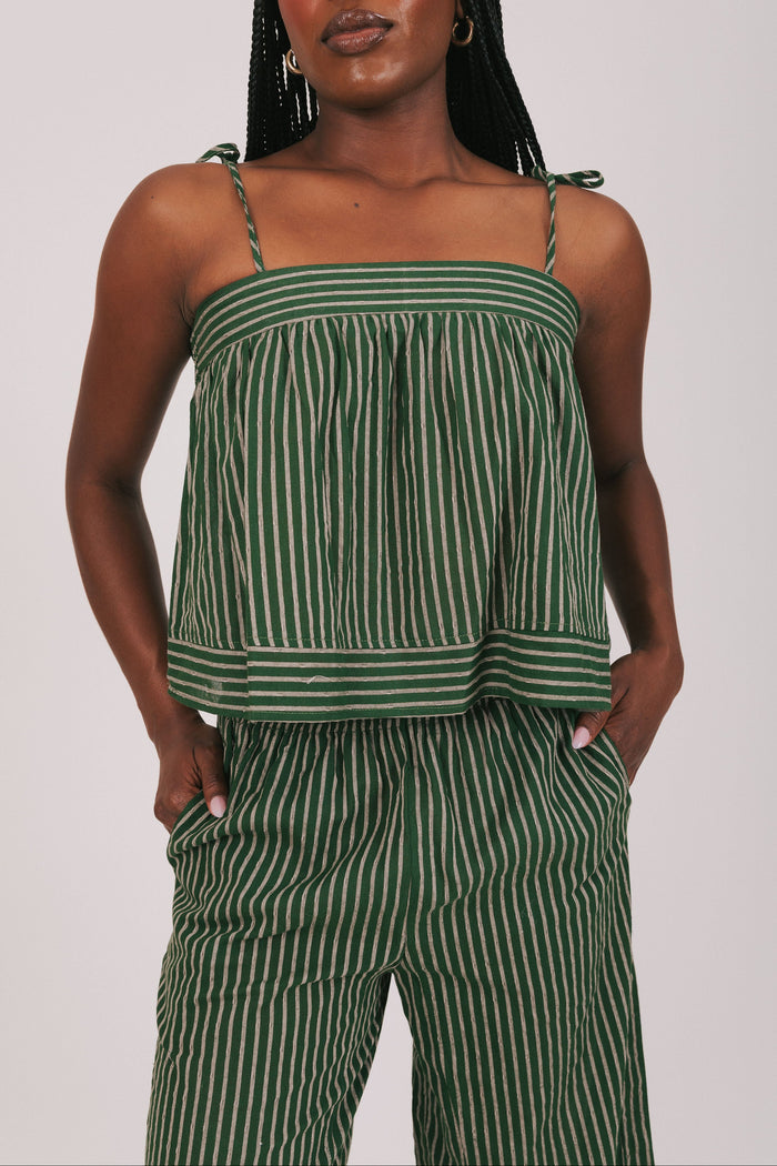 green and tan striped top with thin straps close
