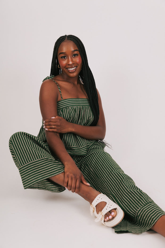 green and tan striped top with thin straps model