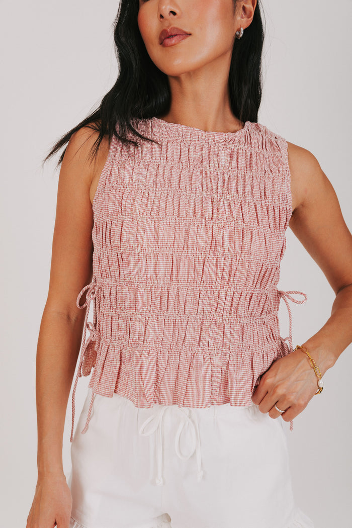 red smocked tank with bows on the side front