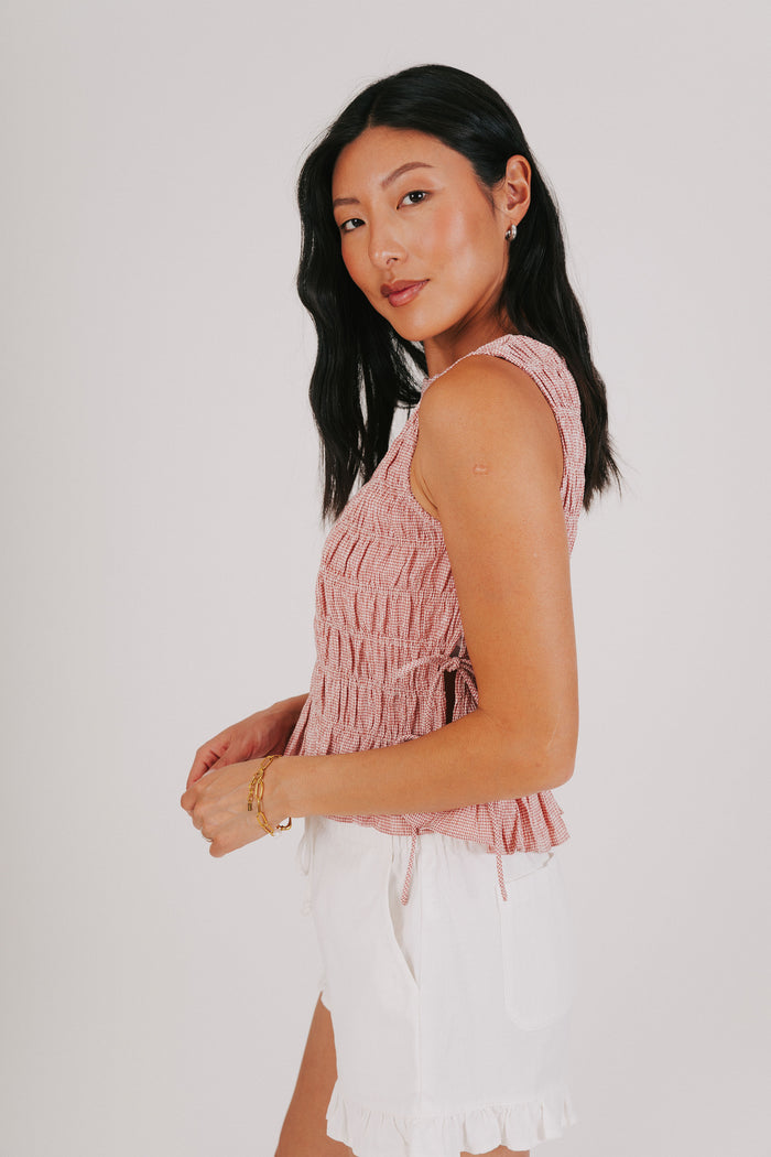 red smocked tank with bows on the side side