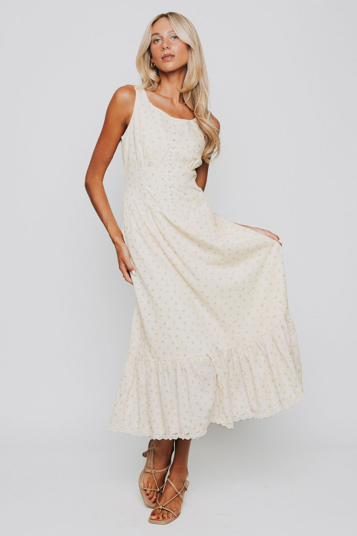 butter yellow midi dress with floral pattern and button down bodice full