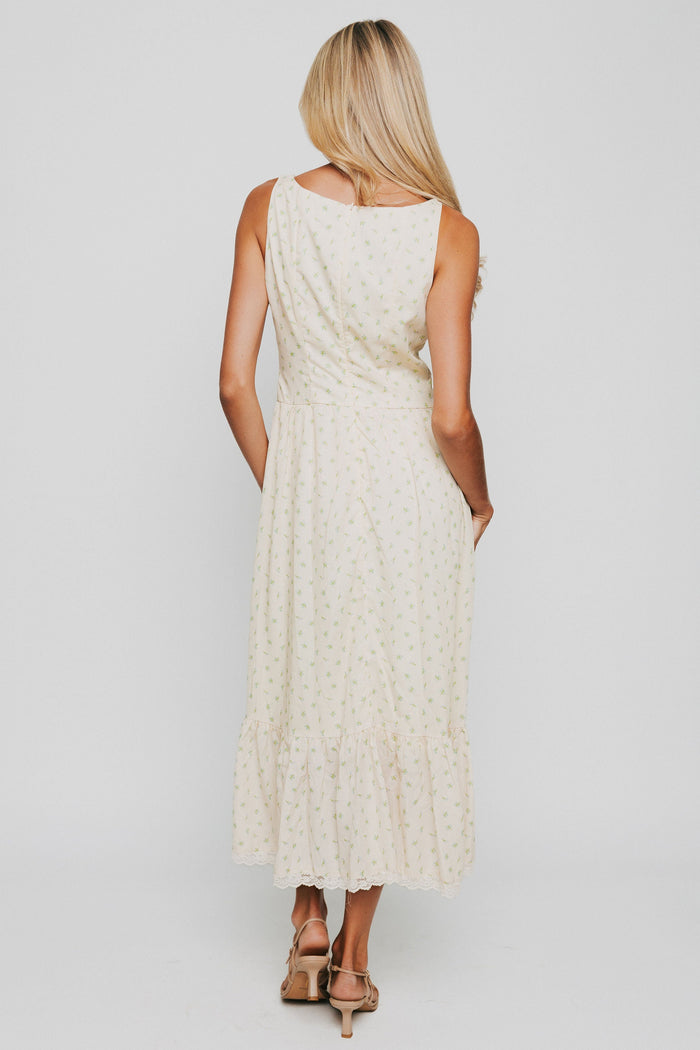 butter yellow midi dress with floral pattern and button down bodice back