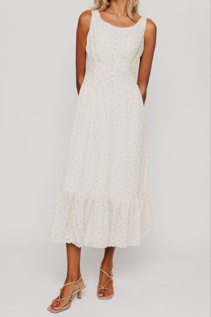 butter yellow midi dress with floral pattern and button down bodice