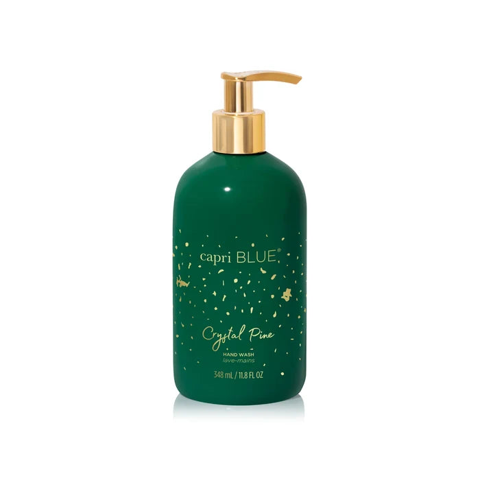 Capri blue crystal pine hand wash in a green bottle with gold accent.