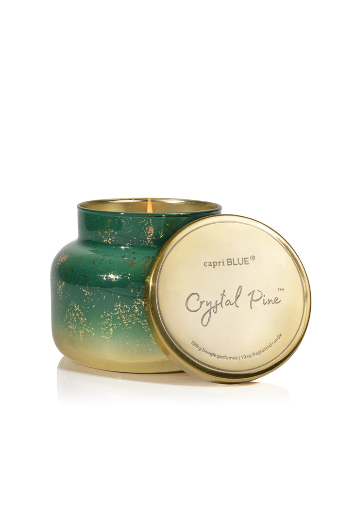 Capri Blue Crystal Pine candle with green and gold design on a white background
