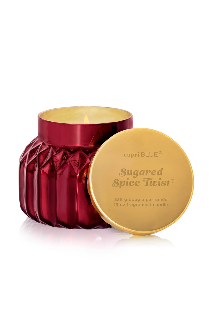 Red faceted jar candle with a sweet spicy scent profile.
