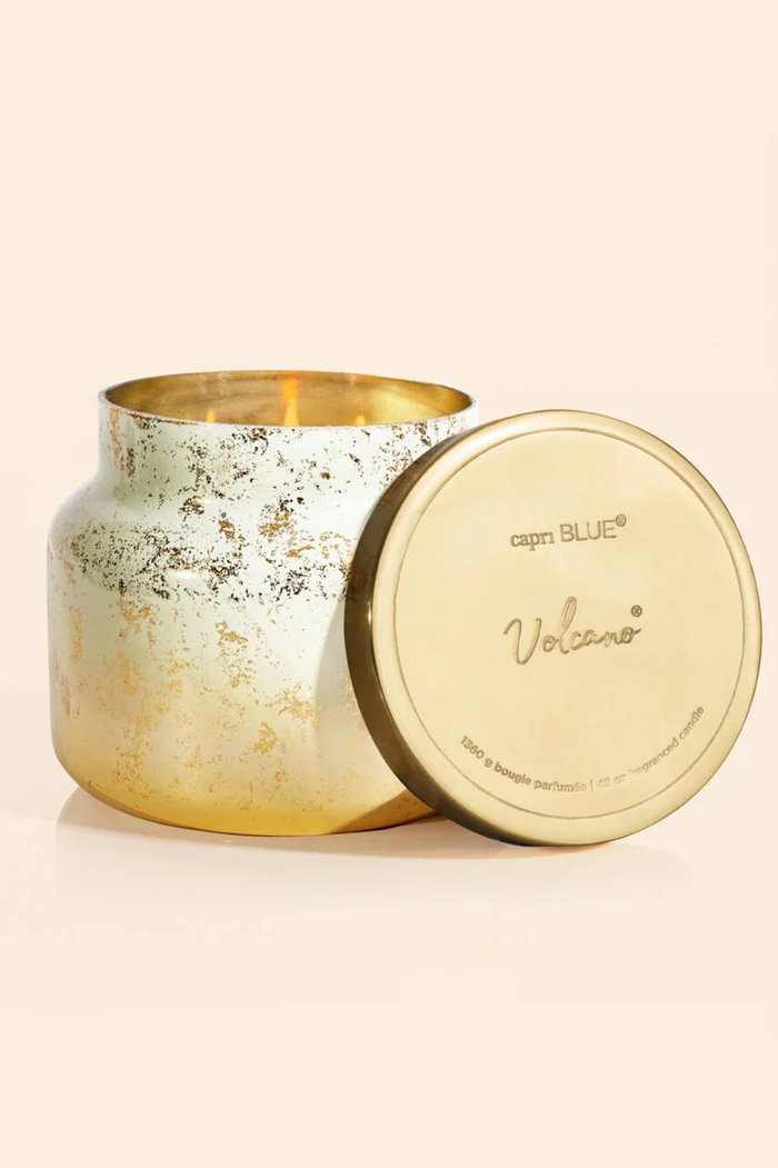Candle jar with white to gold ombre with gold flecks and a brushed gold lid.