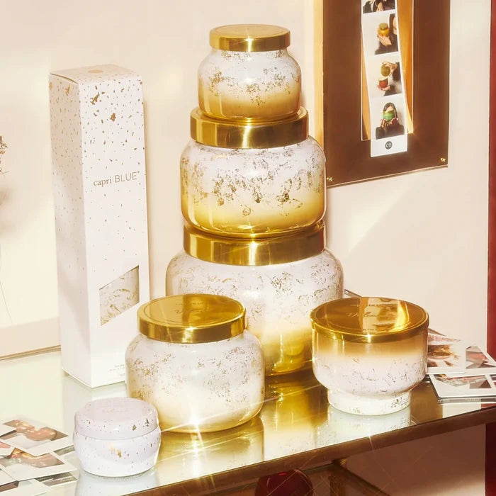 Entire collection of glimmer candles in volcano by capri blue in various sizes.