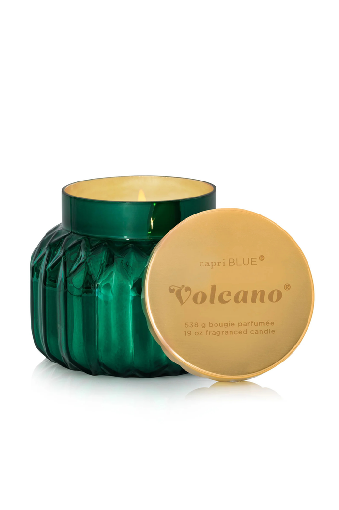 Faceted green candle jar with gold lid in scent Volcano by Capri Blue