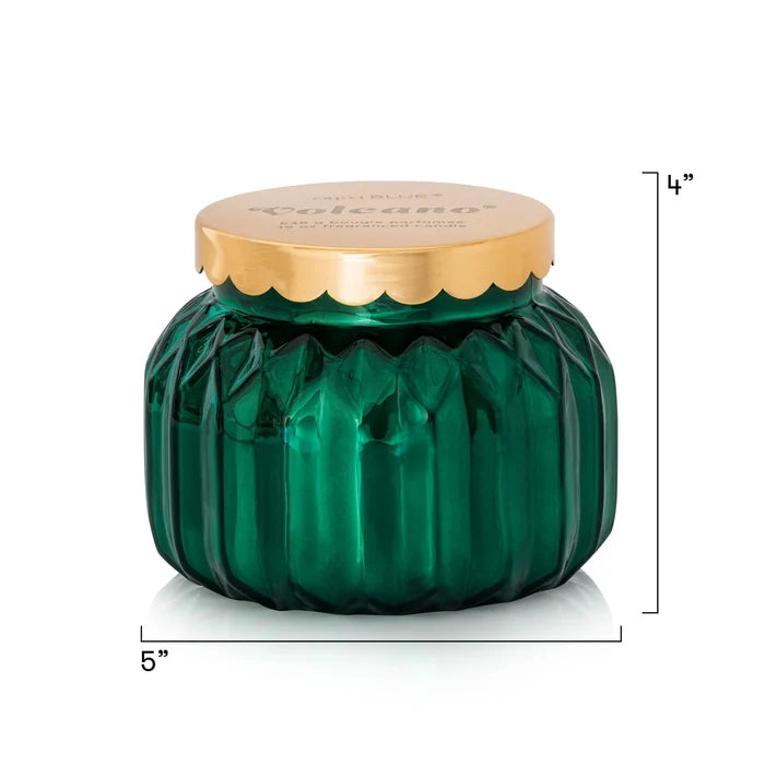 Green faceted jar candle with a gold scalloped lid in scent Volcano by Capri Blue.