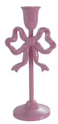 Pink candle holder with bow design on a white background