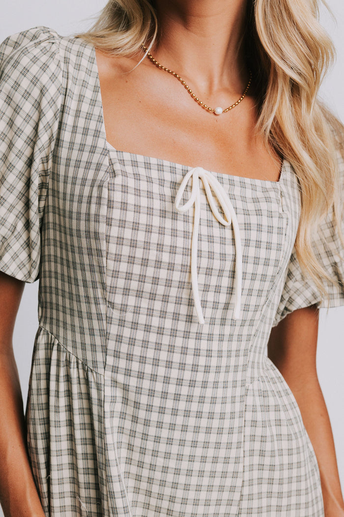 plaid basque waist dress with bow details close