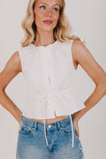 white sleeveless top with tie at the waist
