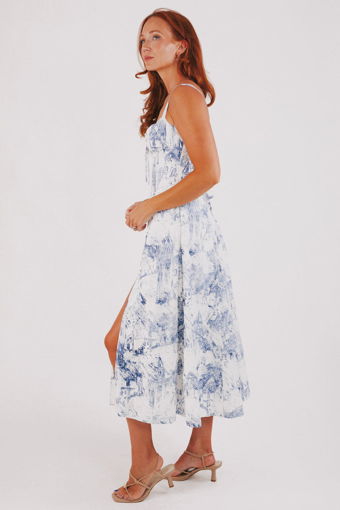 white dress with blue city print and structured bodice side
