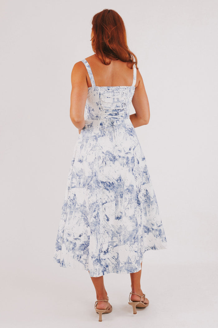 white dress with blue city print and structured bodice back