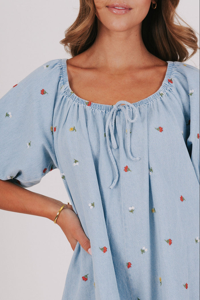 denim romper with with embroidered flowers