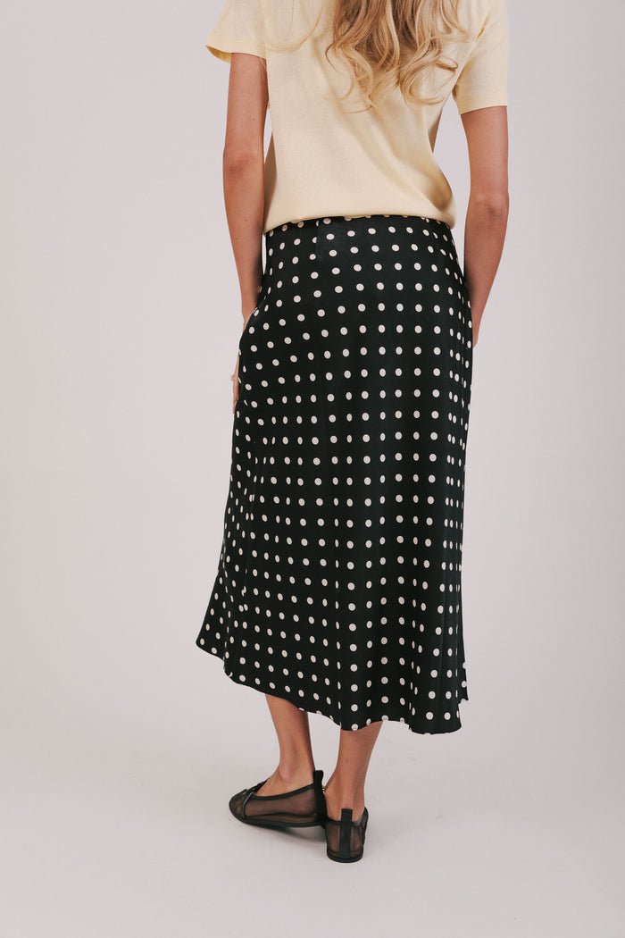 Satin maxi length skirt in black with white polka dots