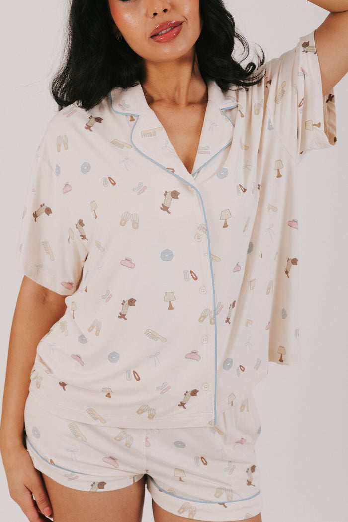 ivory top with buttons and fun print