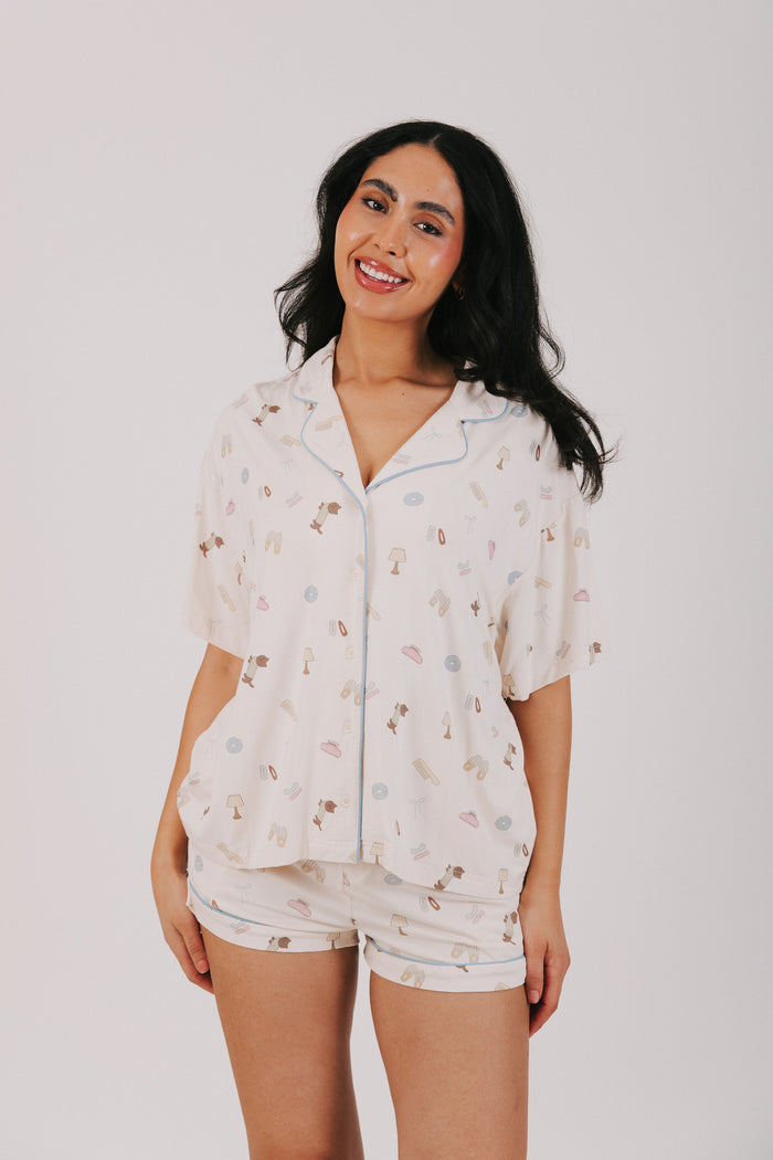 ivory top with buttons and fun print