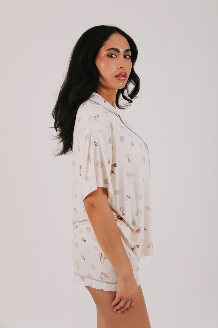 ivory top with buttons and fun print