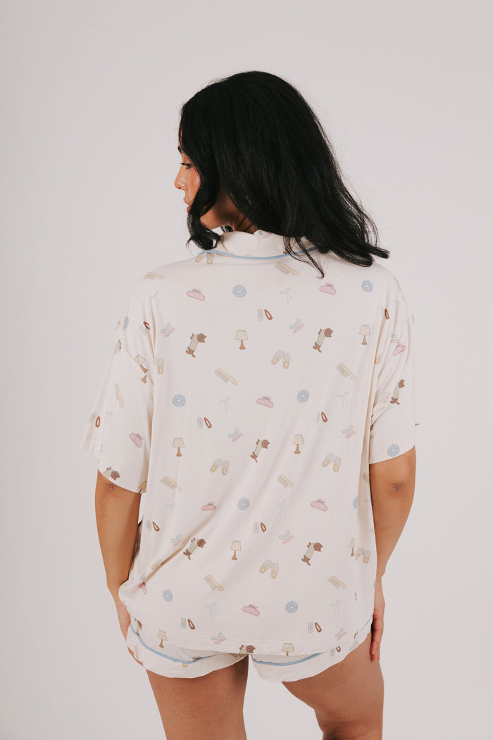 ivory top with buttons and fun print