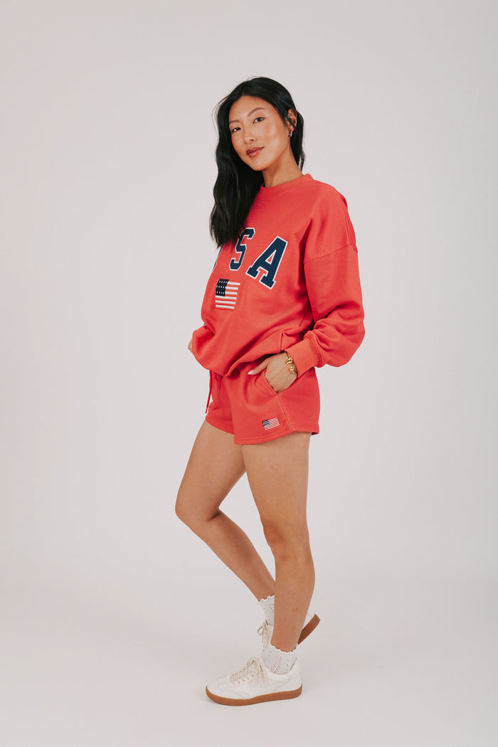 red sweat shorts with USA decal