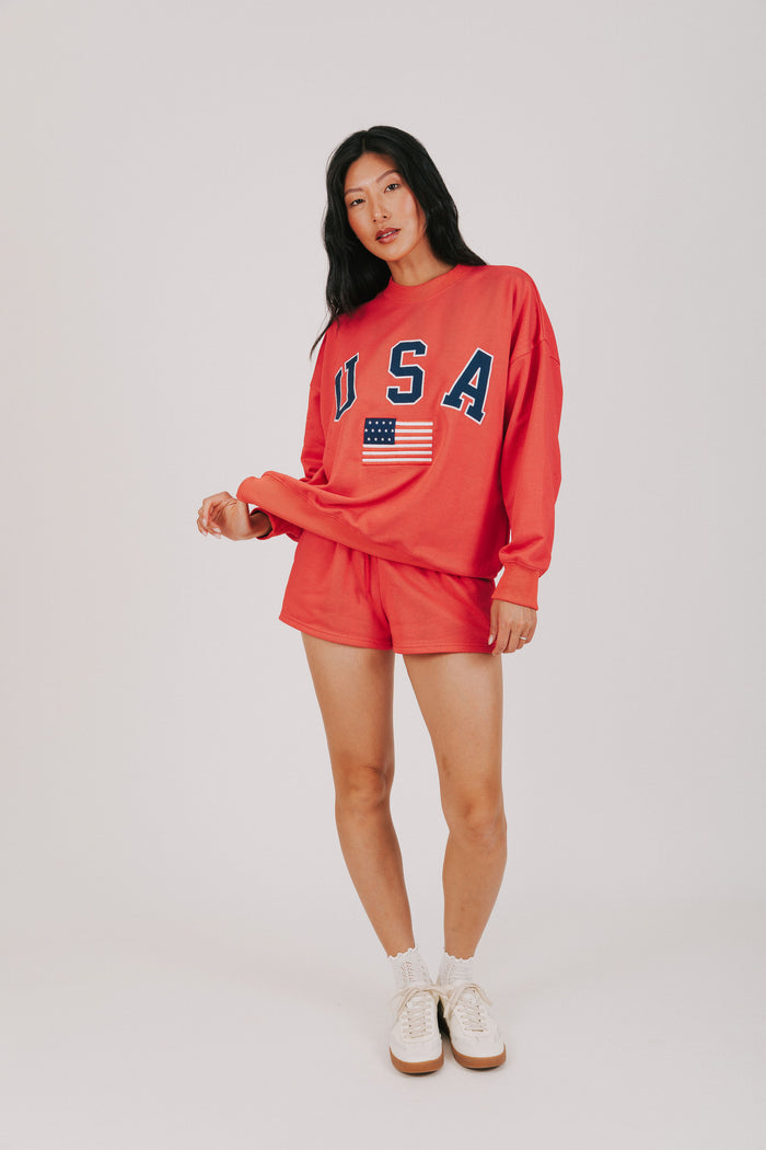 red sweat shorts with USA decal