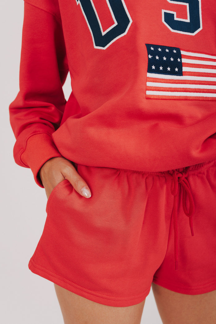 red sweat shorts with USA decal