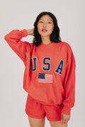red sweatshirt with USA and the flag