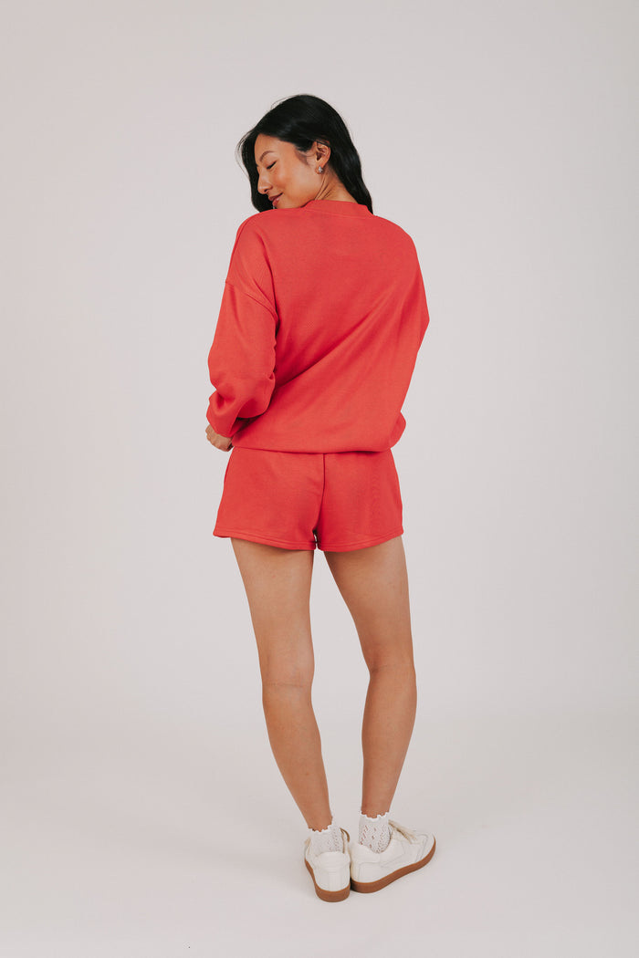 red sweatshirt with USA and the flag
