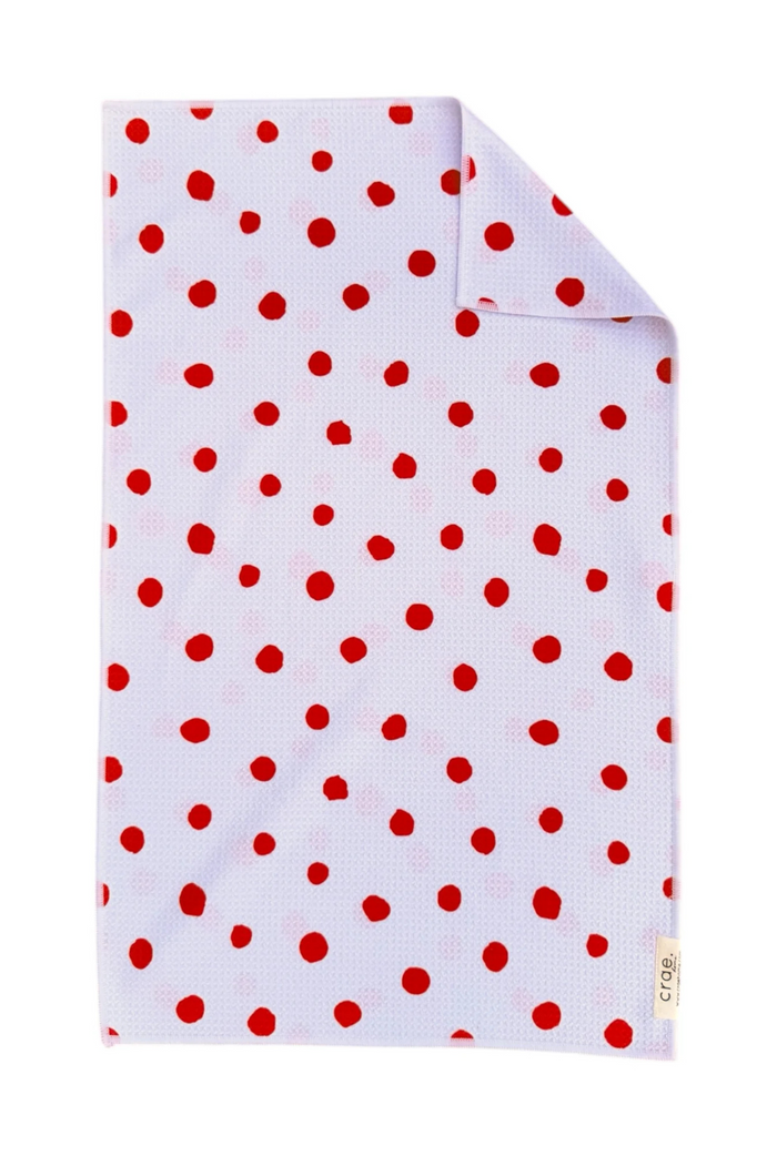 White microfiber hand towel with red polka dots