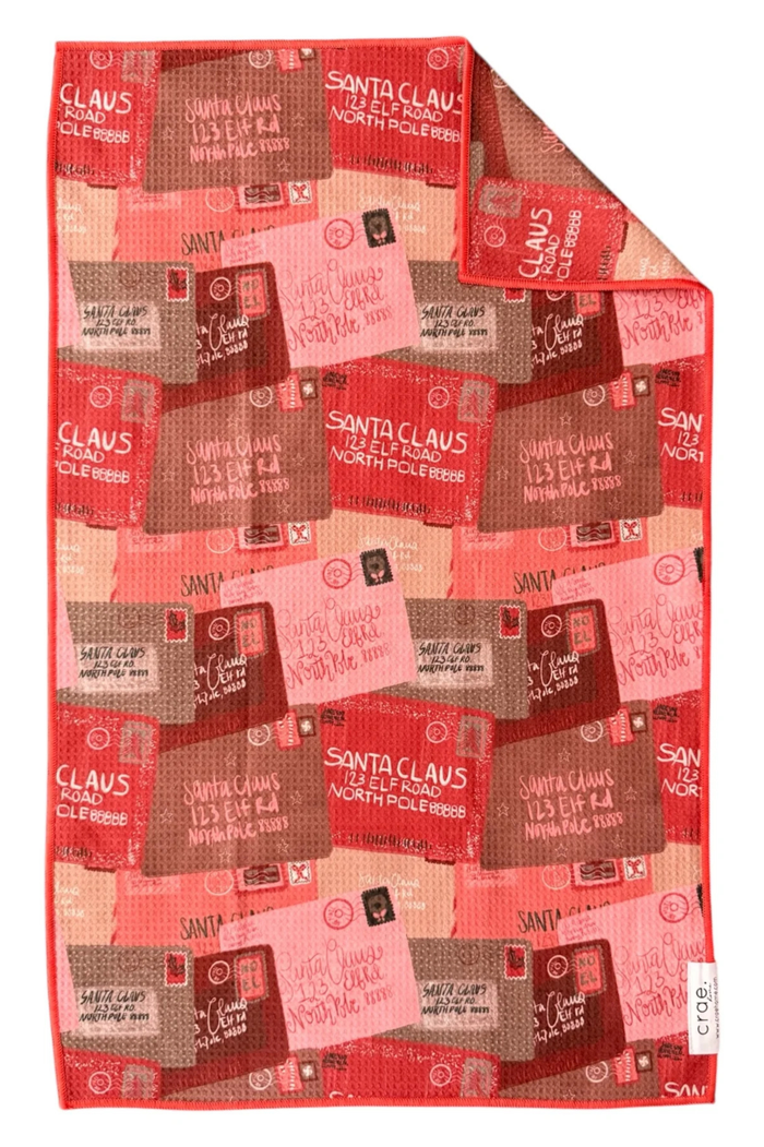Red microfiber towel patterned with letters to santa clause